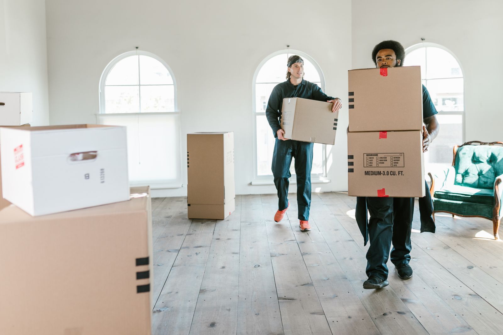Nyati Movers team carrying packed boxes into a home in Nairobi